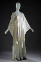 White caftan dress with gathered knotted shoulder and asymmetrical hem