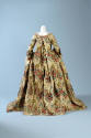 Back view of floral pattern brocaded silk floor length gown, wide skirt with train