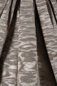 Detail of taupe silk moire dress pleats 