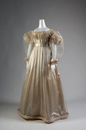Off-white satin floor length dress with net overlay, puff sleeves with sheer long net over slee…