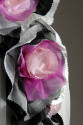 Detail of large pink, fuchsia, black and white silk flower