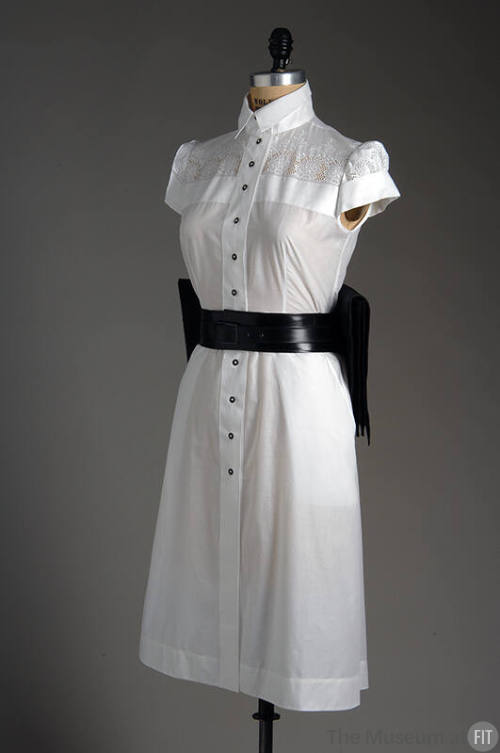 White cap sleeve to-the-knee button front dress with wide black leather belt