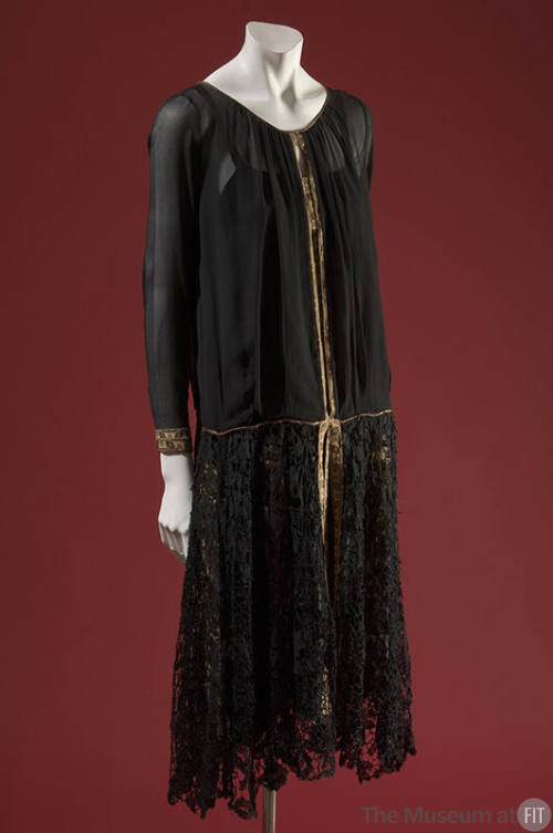 Black sheer long sleeve dress with lace skirt and gold ribbon trim