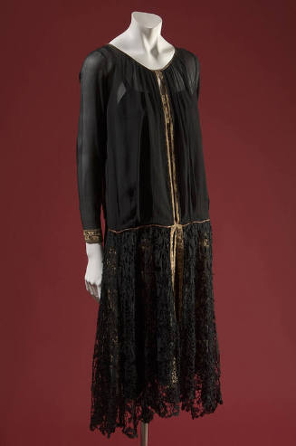 Black sheer long sleeve dress with lace skirt and gold ribbon trim