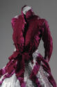 Detail view of white and fuchsia tye-dye long sleeve button front dress with ribbon trim and wa…