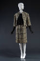 Black and off-white wool houndstooth check jacket with 3/4 sleeves, matching slim skirt and bla…