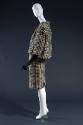 Side view of black and off-white wool houndstooth check jacket with 3/4 sleeves, matching slim …