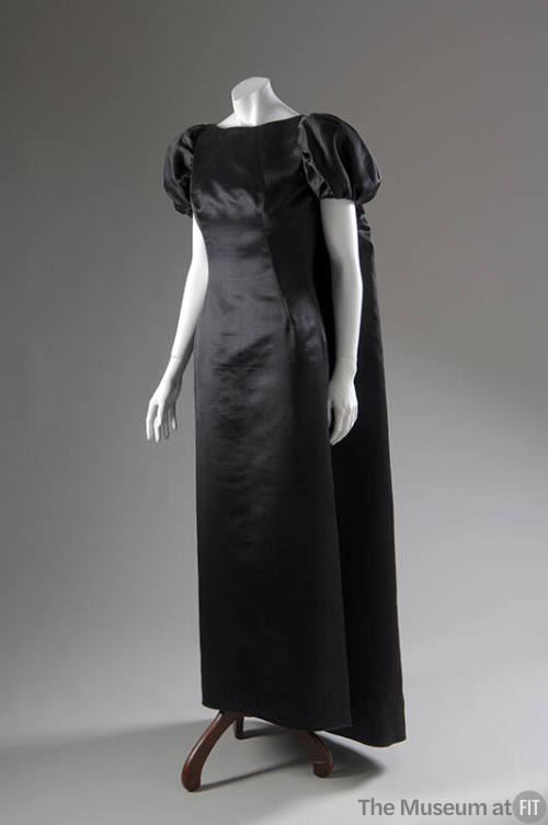 Black silk floor length dress with matching short puff sleeve floor length cape 