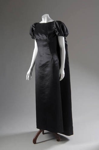 Black silk floor length dress with matching short puff sleeve floor length cape 