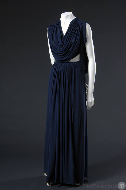 Sleeveless floor length blue silk dress with draped bodice, bare midriff and gathered skirt