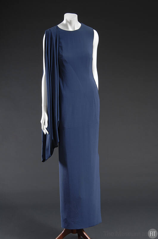 Blue floor length sleeveless dress with draped gathered shoulder swag 