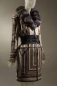 Coat in geometric stripes of brown, tan, off-white and black with wide black double buckle clos…