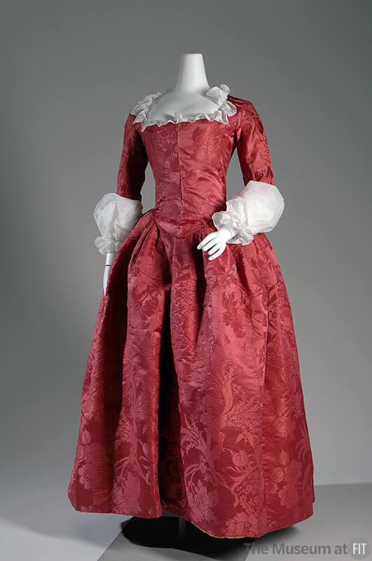 Red silk floor length damask dress with flower and fruit pattern, fitted bodice, full skirt and…