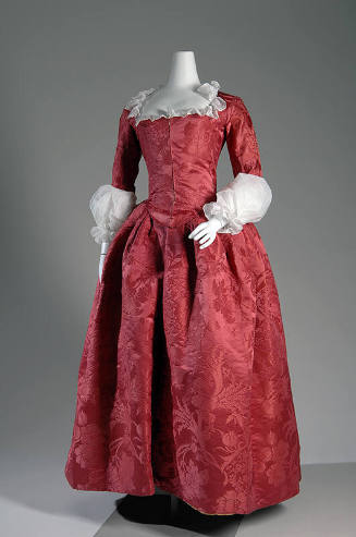Red silk floor length damask dress with flower and fruit pattern, fitted bodice, full skirt and…