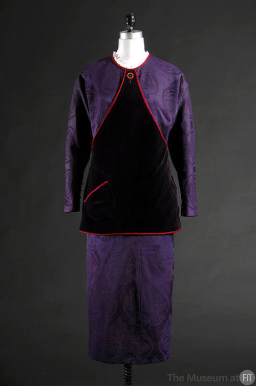 Purple silk damask dress with dark purple fuchsia-trimmed triangular tunic over bodice and tape…