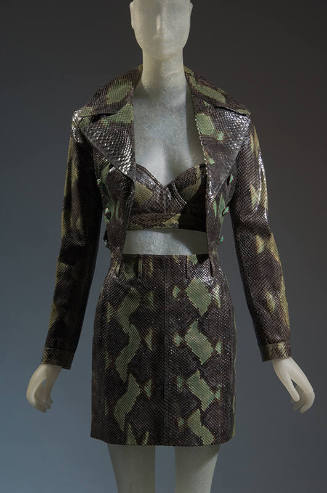 Green snakeskin ensemble of cropped jacket with wide notched lapels, matching bra and miniskirt