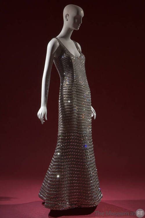 Crystal rhinestone sleeveless evening gown with scoop neckline and floor length flared skirt