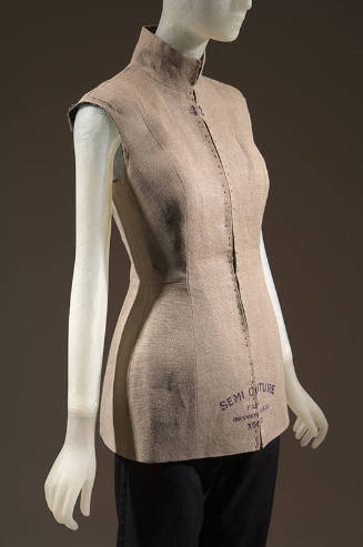 Beige linen sleeveless tunic/jacket molded like a dress form with stand collar and full length …