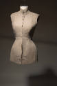 Alternate view of beige linen tunic/jacket on a torso dress form with Semi Couture writing visi…