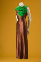 Brown silk sleeveless below ankle evening gown with bright green velvet neckline and oversize b…