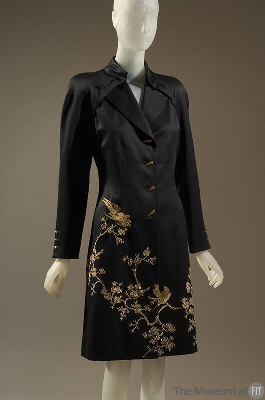 Black coatdress with gold metallic embroidery of birds and cherry blossom branches and gold tig…