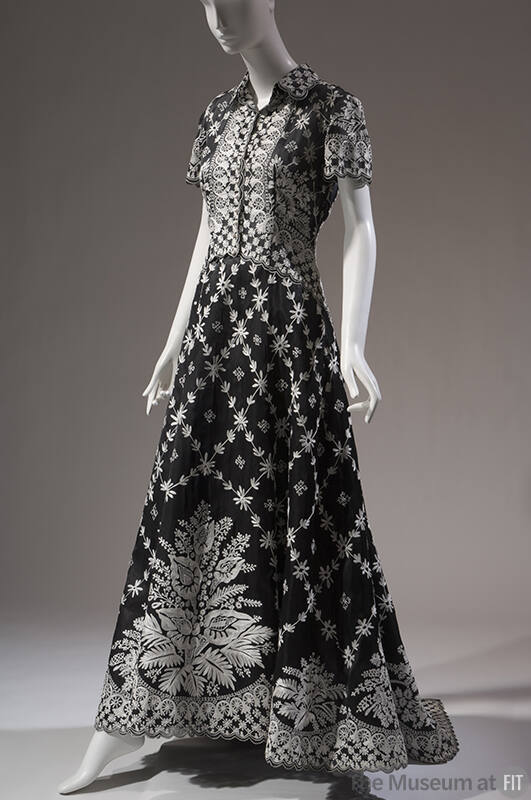 Black and white floral floor length evening dress with short sleeve shirtdress styling, curved …
