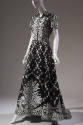 Black and white floral floor length evening dress with short sleeve shirtdress styling, curved …