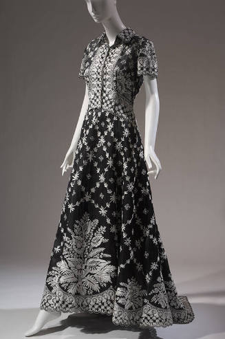 Black and white floral floor length evening dress with short sleeve shirtdress styling, curved …