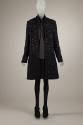 Ensemble of black coat embellished with square black paillettes, dark grey blouse, black above …
