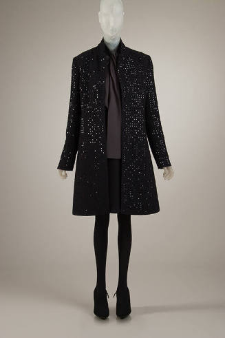 Ensemble of black coat embellished with square black paillettes, dark grey blouse, black above …