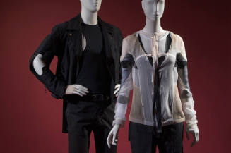Man’s black motorcycle style jacket, tank top and pants on left with women’s sheer beige, black…