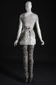 Back view of grey and white mini dress showing piecework marbled leather and cotton tulle, grey…