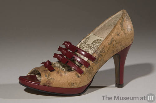 Tan floral print high heel open toe pump with red straps with bows at instep