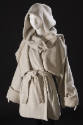 Off-white hooded  hip length wool coat with hanging front flaps, wide cuffed sleeves, sash belt