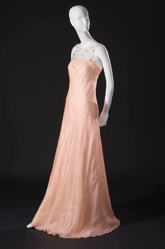 Floor length sleeveless pink silk dress with sheer neck panel with mother-of-pearl appliques 