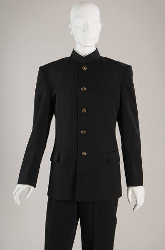 Black jacket with band collar, flap pockets, brass buttons and black pants