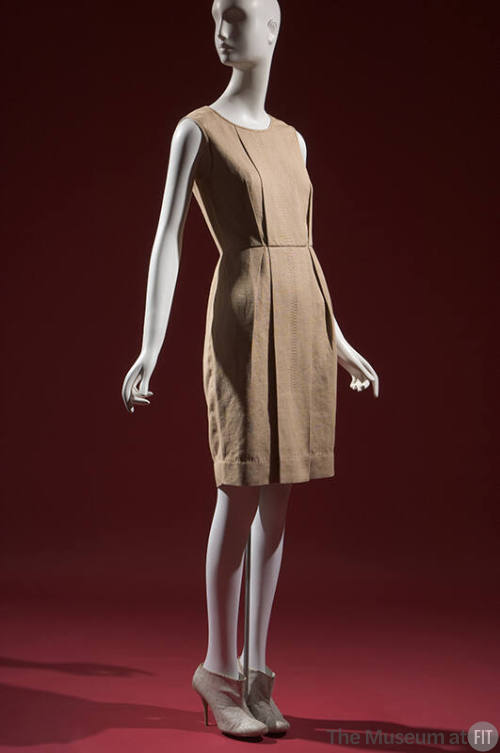 Beige burlap sleeveless knee-length dress with topstitiching and pleat details 