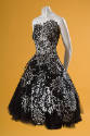 Strapless to-the-knee dress with black and white cut-out snowflakes over black tulle, full skir…