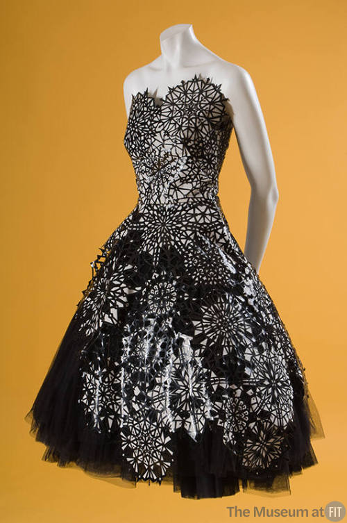 Strapless to-the-knee dress with black and white cut-out snowflakes over black tulle, full skir…