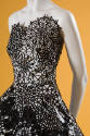 Detail of strapless dress bodice with cut-out lace snowflakes