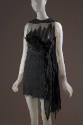 Black sleeveless mini dress with sheer bodice with feathers, crinckled skirt with long side pan…