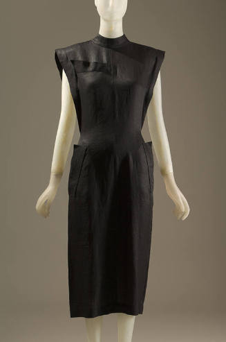Black below-the-knee dress with cap sleeves and side pockets