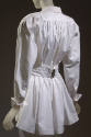 Back view of white cotton long sleeve jacket with gathered back and wide pleated belt