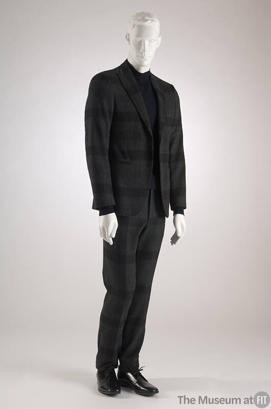 Dark grey suit with green and black windowpane check notched lapel long sleeve jacket and match…
