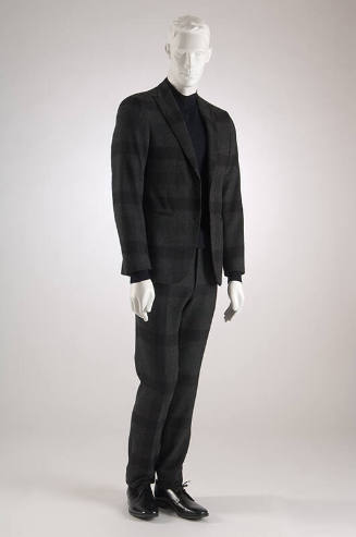 Dark grey suit with green and black windowpane check notched lapel long sleeve jacket and match…