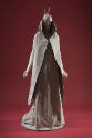 Grey sleeveless cape with high collar and matching floor length dress with train 