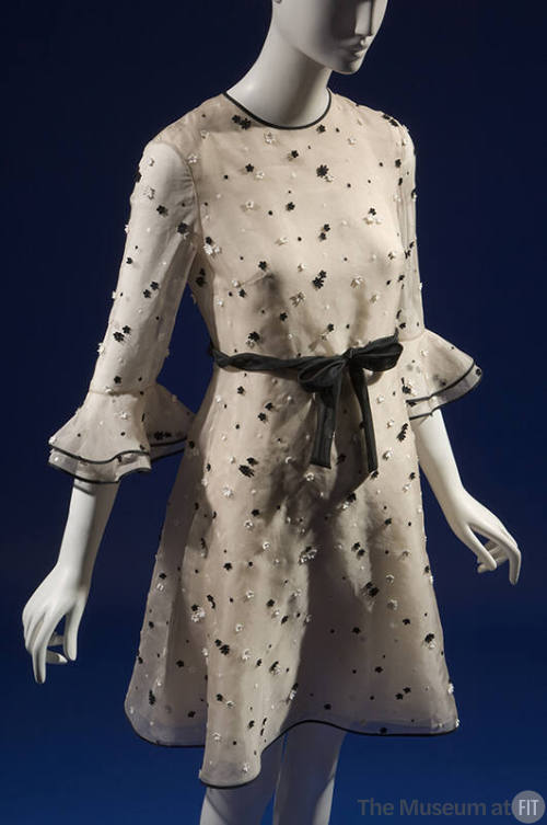 Beige silk dress with black and white daisy appliqués overall, round neckline, 3/4 sleeves with…