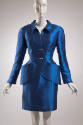Blue silk long sleeve jacket with two toggle buttons and hip pockets, matching above-the-knee l…