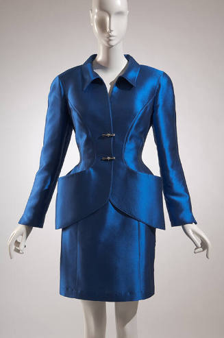 Blue silk long sleeve jacket with two toggle buttons and hip pockets, matching above-the-knee l…