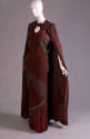 Red/brown evening ensemble of floor length cape, top with keyhole neck and matching floor lengt…